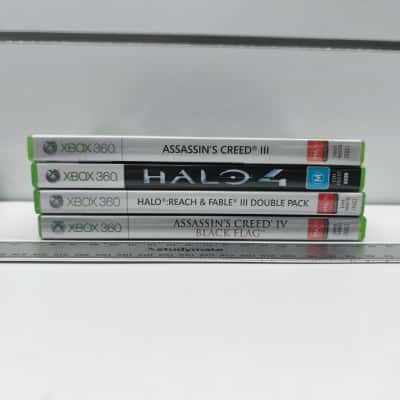 Xbox 360 Game Bundle (4 titles: Assassin's Creed III, Halo 4, Halo Reach/Fable III Double Pack, Assassin's Creed IV Black Flag)