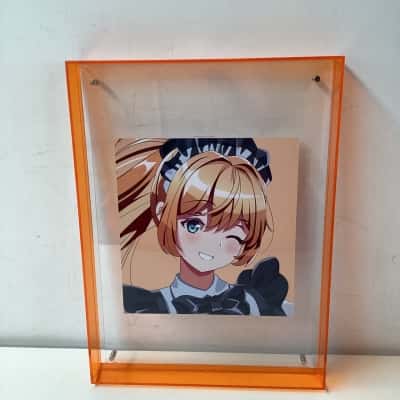 Maid cafe girls anime art in orange acrylic frame. 