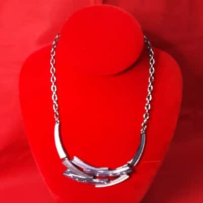 Statement  necklace featuring metallic silvertone hardware paired with textured blue lilac elements