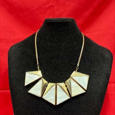 Ladies Statement Necklace Featuring geometric gold tone triangles 