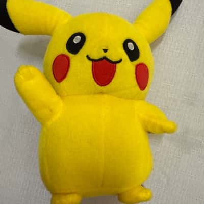 Pokémon Pikachu plush toy. It is a soft, cuddly, and stuffed animal figure. (B15)