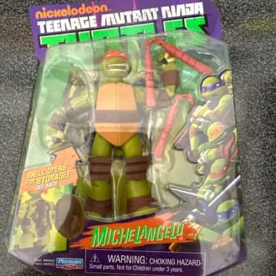 Nickelodeon Teenage Mutant Ninja Turtles Battle Shell Michelangelo action figure.It includes weapon accessories(B8)
