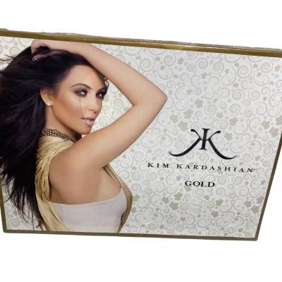  boxed Kim Kardashian Gold Eau de Parfum fragrance set featuring a white and gold floral background with a portrait of Kim Kardashian on the cover