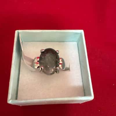  Women's Silver Tone Ring featuring a Polished Oval Shaped Greenish/ Grey Stone 