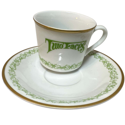 demitasse cup and saucer set from the "World's Greatest Restaurants" collection, specifically featuring "TWO FACES, VICTORIA, AUSTRALIA"