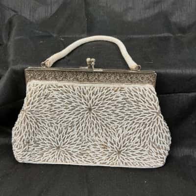 Mid-century hand beaded off-white evening purse with ornate frame