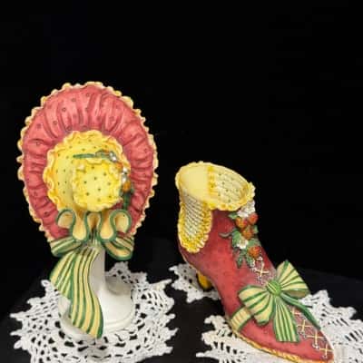 Red strawberry hat stand and shoe figurines 