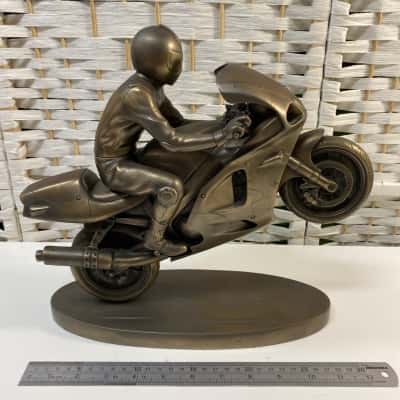 handcrafted metallic-finish sculpture of a motorcycle 