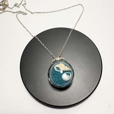 Unique Ocean Glass Pendant Necklace filled with sea shells and blue beads