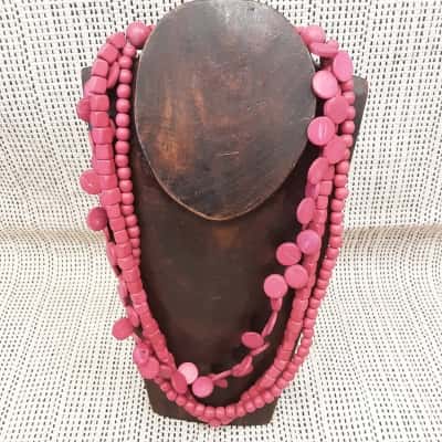 Multistrand pink dyed wooden bead neck lace with round disc and square design adjustable length cord 