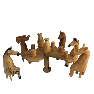 Wooden African Animals Sitting around a Table as pictured