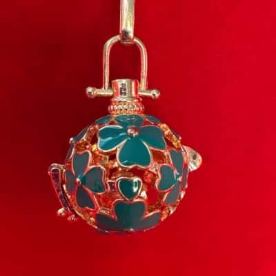  Women's Gold Tone Aromatherapy Necklace featuring a Teal Enamel Clover Design on a Sphere Locket 