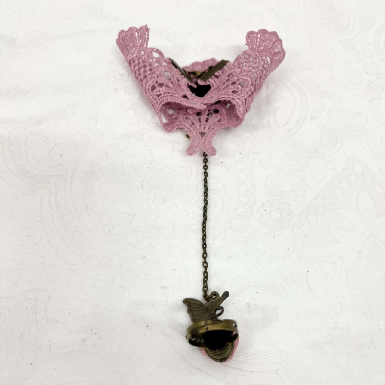 Pink lace wristlet w/attached rose ring(s)