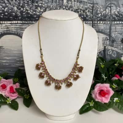 Pretty gold tone and purple diamantés necklace 