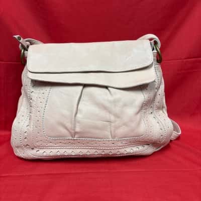  Women's Cadelle Leather Backpack featuring Decorative Perforation Along its Edges Pale Pink
