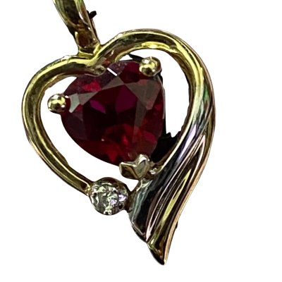9CT GOLD HEART SHAPED PENDANT WITH A RED STONE 