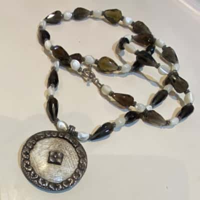 Bohemian Style Beaded Necklace Teardrop Shaped Smokey Quartz Beads with Alternating Polished Cream Colour Beads Anchored With. ALarge Circular Pendant 